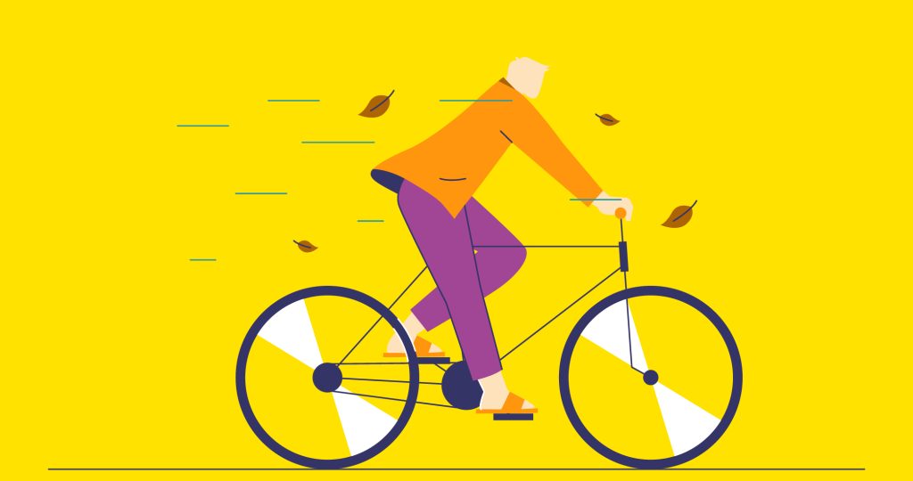 Ilustración de una persona paseando en bicicleta entre hojas que caen de los árboles para contar cómo afecta el otoño al estado de ánimo.